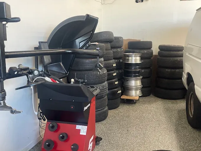 Stacked tires and wheels in the Mondragon Towing service bay